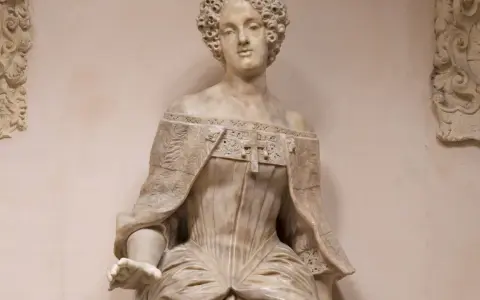 Busto in marmo di Elena Cornaro, con acconciatura riccia e abito elaborato.
