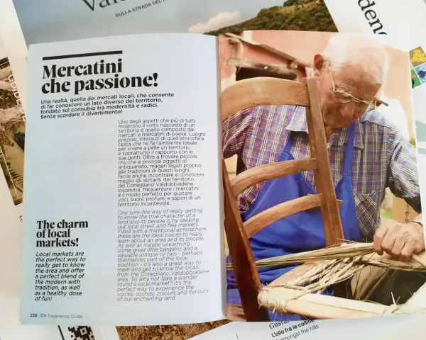Artigiano locale lavora su una sedia, un'immagine che evoca la tradizione e i sapori della strada del Prosecco.