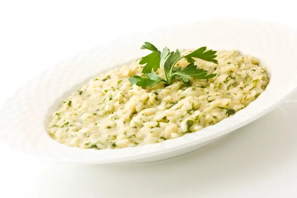 Risotto cremoso con prezzemolo, un assaggio di pesce go Venezia.